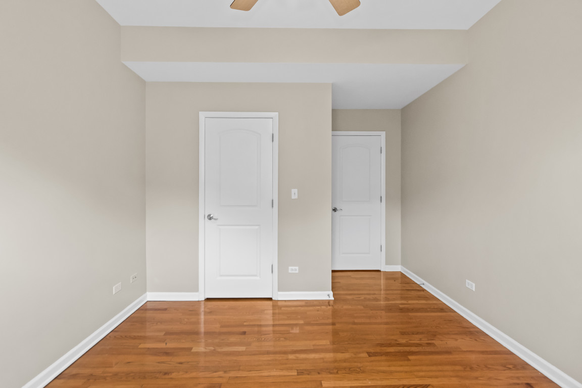 2710 North Artesian Avenue Chicago, IL 60647 - Photo 38 of 61 a view of an empty room with wooden floor