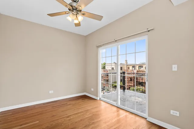 a kitchen with granite countertop wooden floors a stove and a microwave