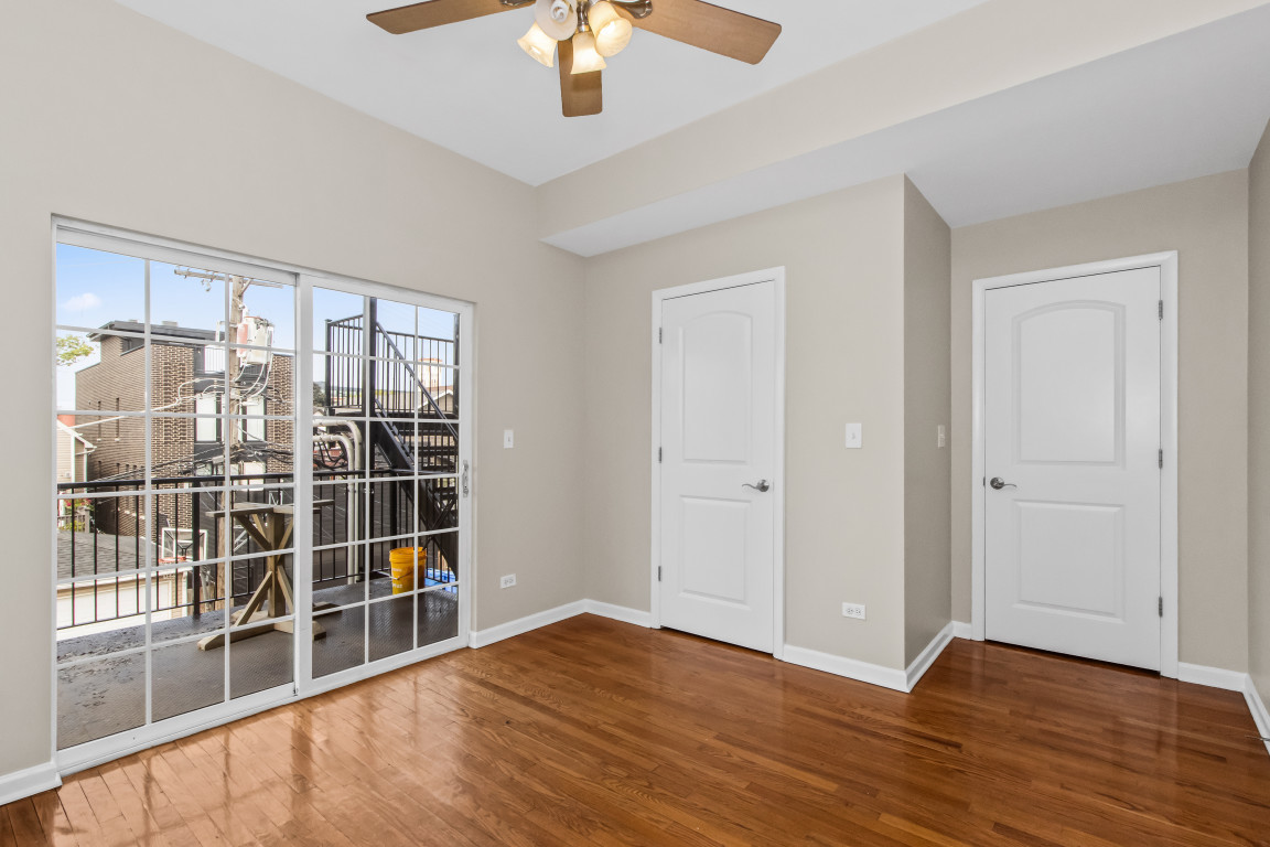 2710 North Artesian Avenue Chicago, IL 60647 - Photo 40 of 61 wooden floor in an empty room with a window
