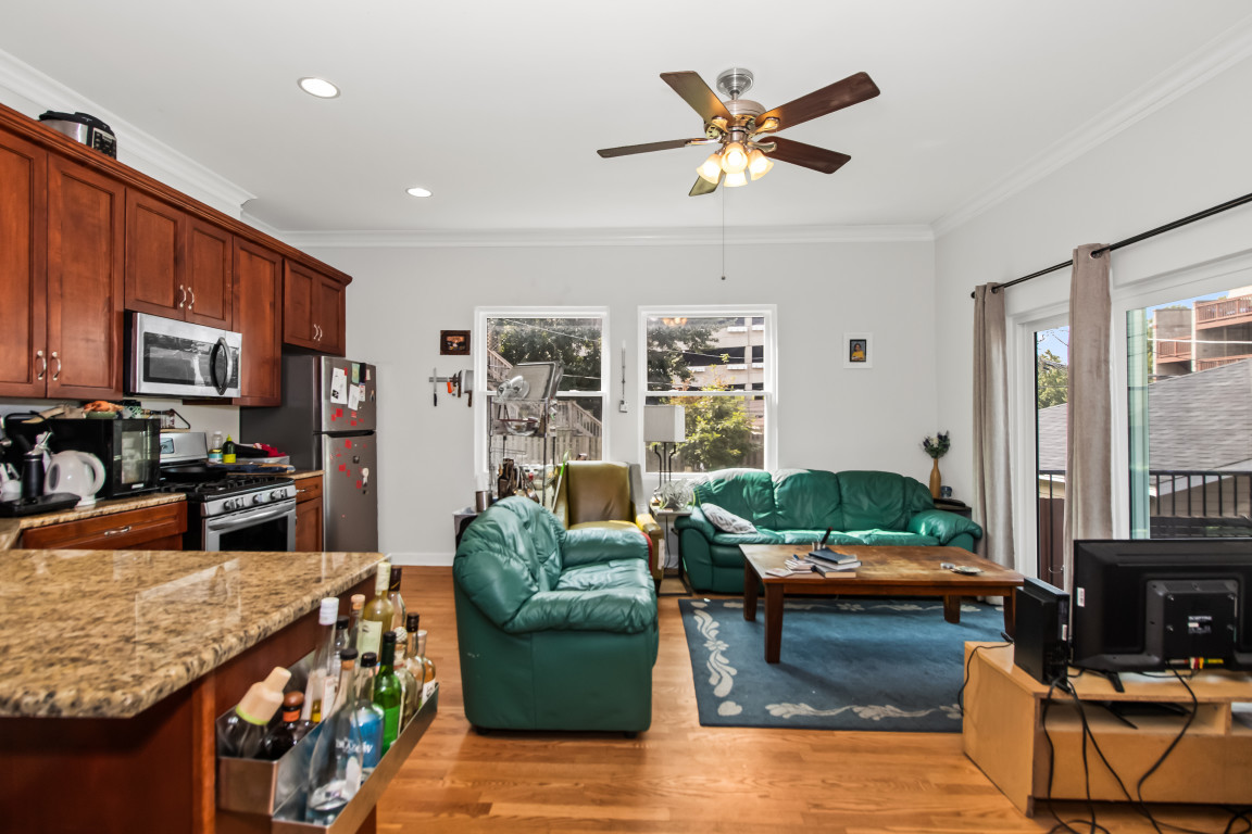 2710 North Artesian Avenue Chicago, IL 60647 - Photo 4 of 61 a living room with furniture kitchen view and a window