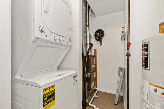 an empty room with a window and a ceiling fan