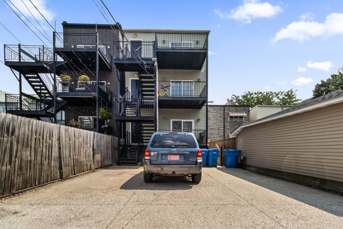 2710 North Artesian Avenue Chicago, IL 60647 - Photo 61 of 61 a car parked in front of a house