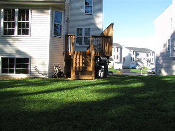 9 Pearlbush Path Worcester, MA 01607 - Photo 25 of 28 a front view of a house with a garden and plants