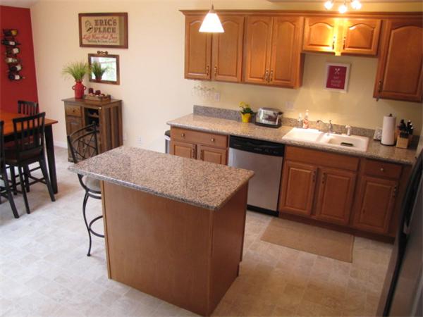 9 Pearlbush Path Worcester, MA 01607 - Photo 5 of 28 a kitchen with stainless steel appliances granite countertop a sink a stove and a refrigerator
