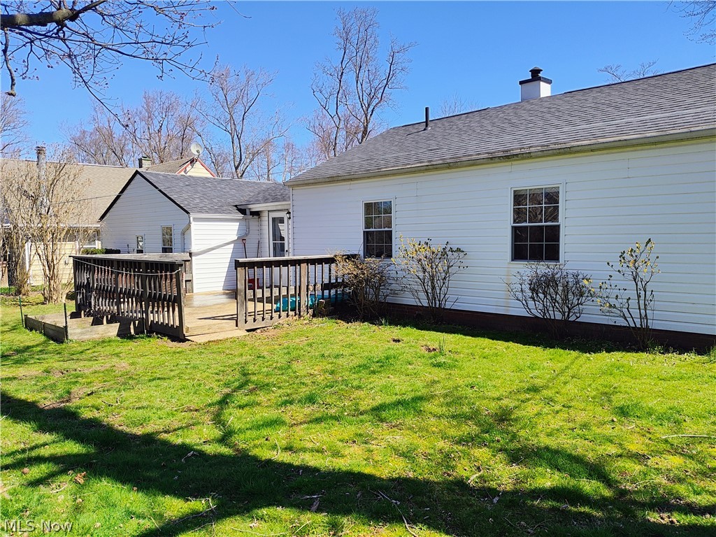 1870 Benjamin Road Madison, OH 44057 - Photo 28 of 30 Back of property featuring a lawn