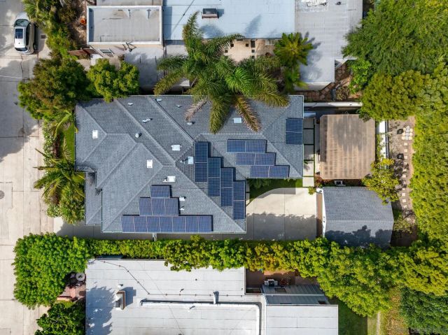 an aerial view of a house with a garden