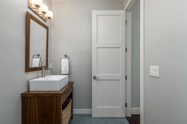 a bathroom with a sink a mirror and vanity