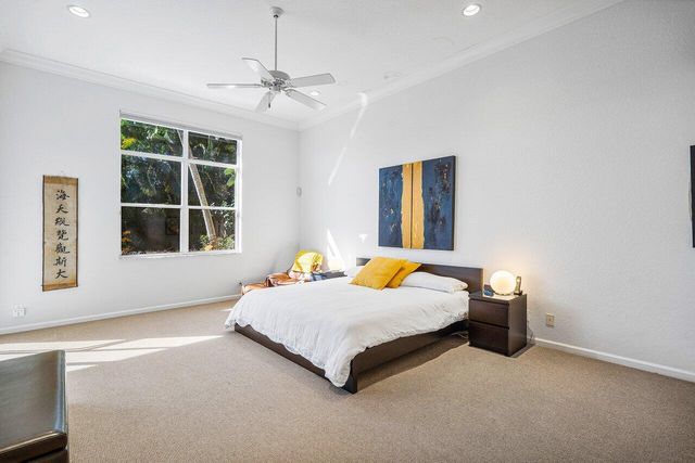 a bed sitting in a room next to a window