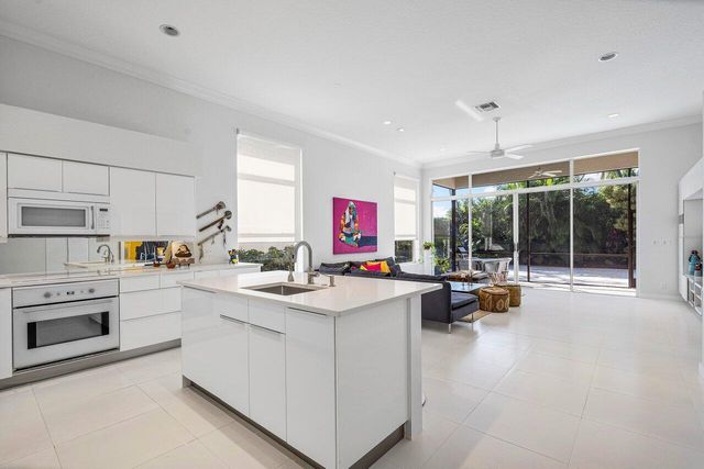 a kitchen that has a lot of cabinets in it