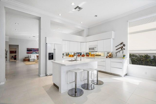 a view of living room filled with furniture and window