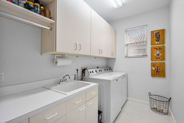 a view of storage and utility room with washer and dryer