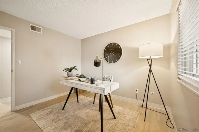 a view of a workspace with furniture