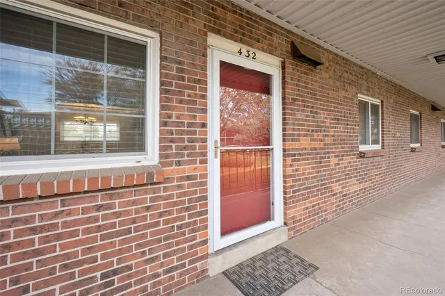 a view of a brick house with a window