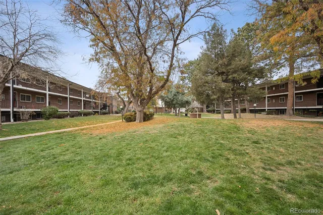 a view of outdoor space with garden and trees