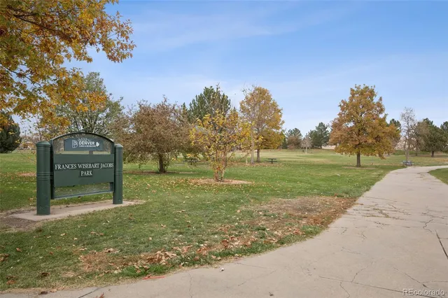 a view of a park with large trees