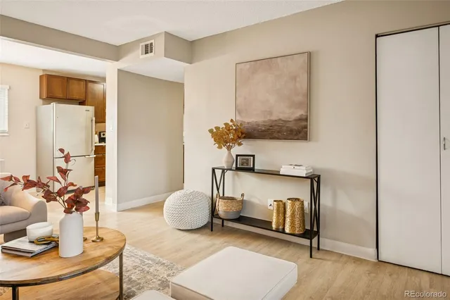 a living room with furniture and a table