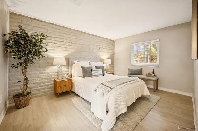 a bed room with a bed and a table