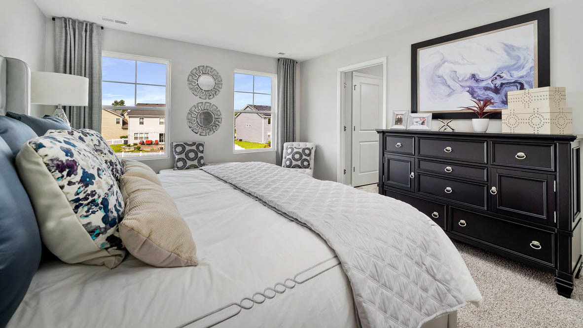 1810 Legacy Pointe Boulevard Plainfield, IL 60586 - Photo 14 of 20 a bedroom with a bed and wooden floor