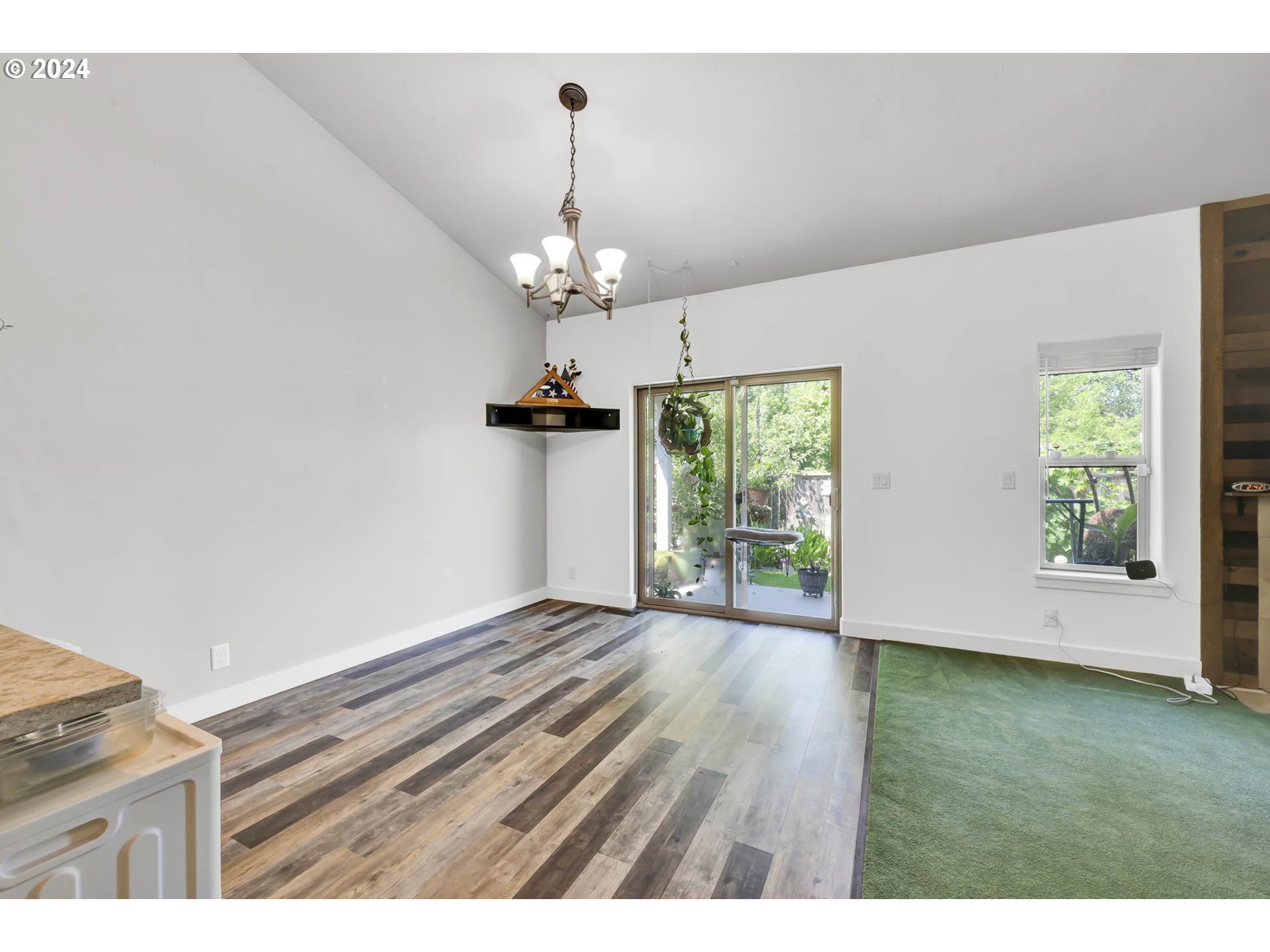945 Pennington Court Eugene, OR 97404 - Photo 15 of 40 a view of livingroom with hardwood floor and window