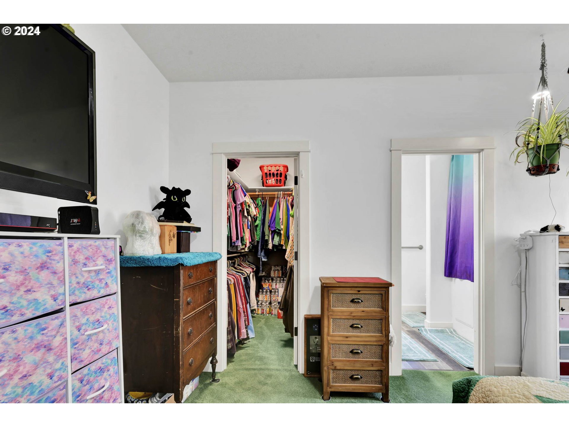 945 Pennington Court Eugene, OR 97404 - Photo 20 of 40 a view of walk in closet with clothes and shoes