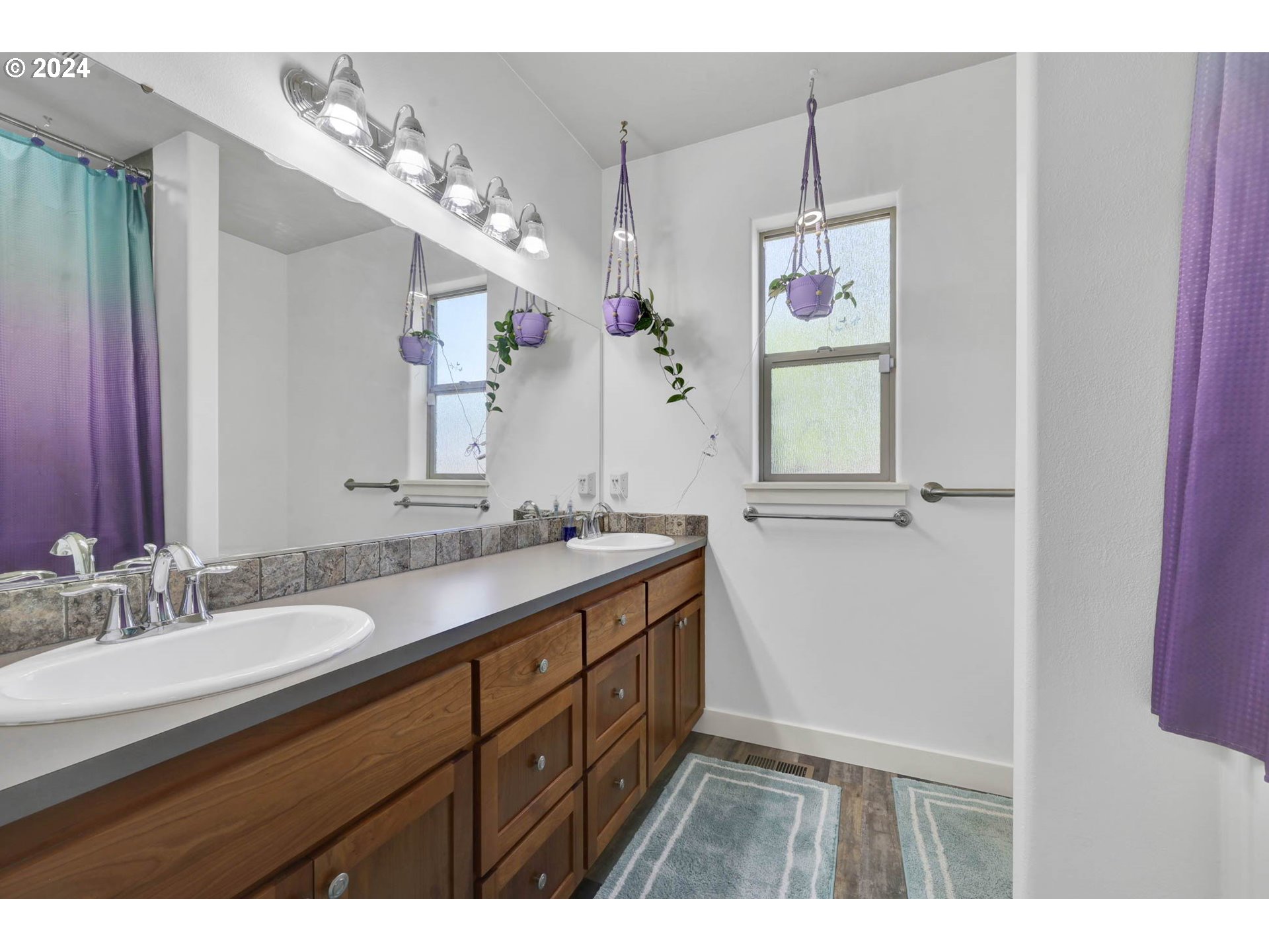 945 Pennington Court Eugene, OR 97404 - Photo 23 of 40 a bathroom with a granite countertop sink mirror and vanity