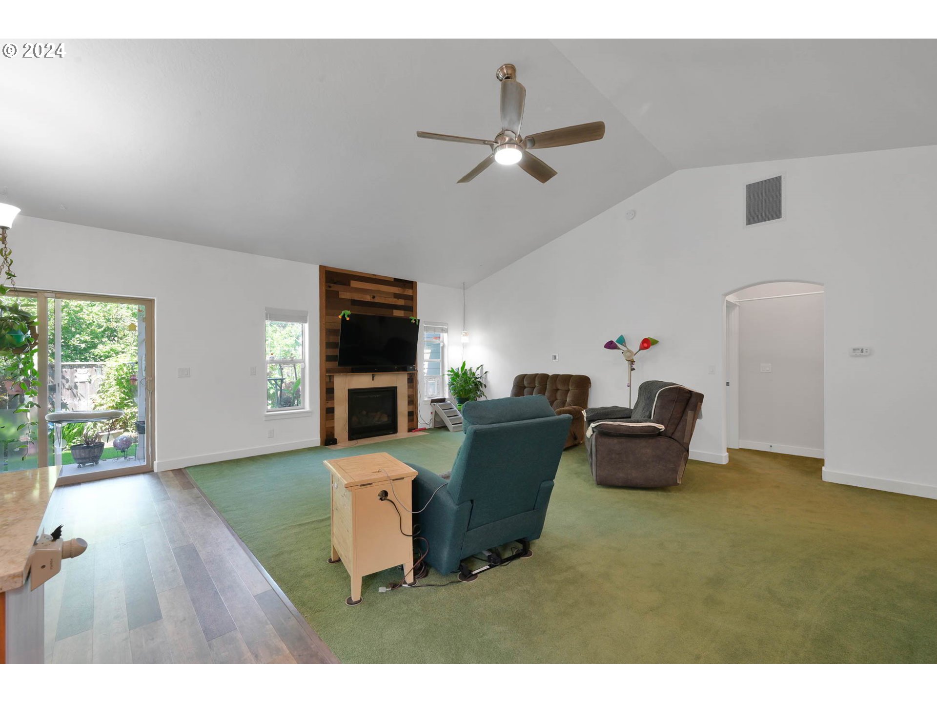 945 Pennington Court Eugene, OR 97404 - Photo 7 of 40 a living room with furniture and a flat screen tv