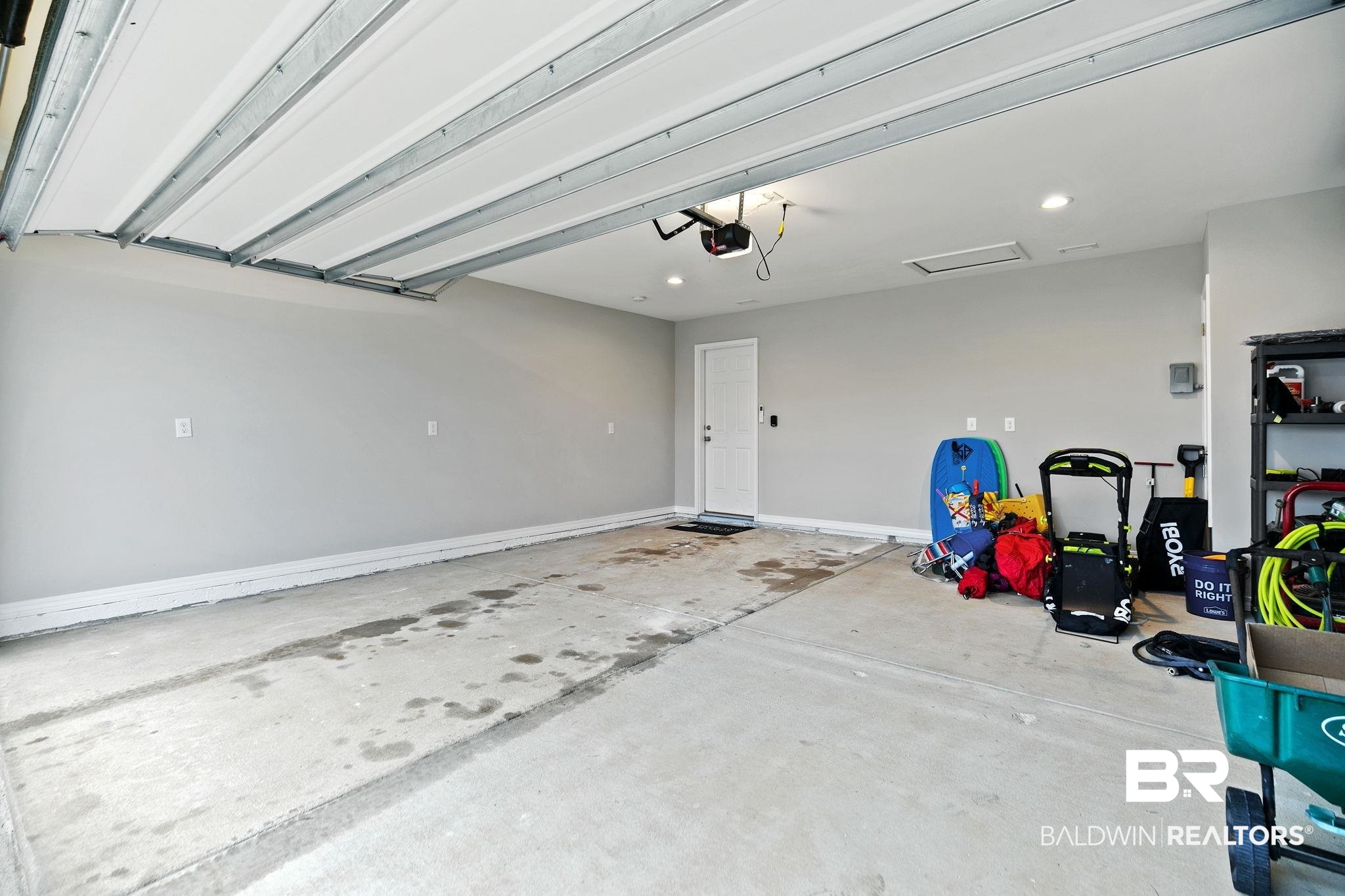 1271 Caper Avenue Foley, AL 36535 - Photo 7 of 29 Garage featuring a garage door opener