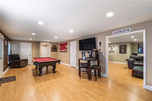 a room with furniture and a wooden floor