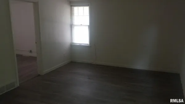 a view of an empty room and window