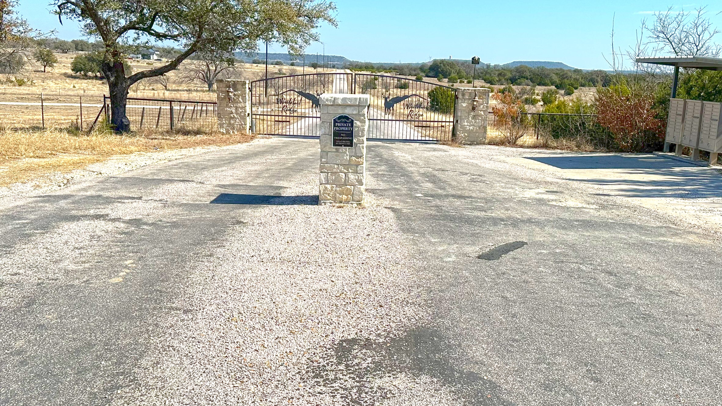 Tbd Whitetail Ridge Drive Kempner, TX 76539 - Photo 2 of 22 View of asphalt road with a gate