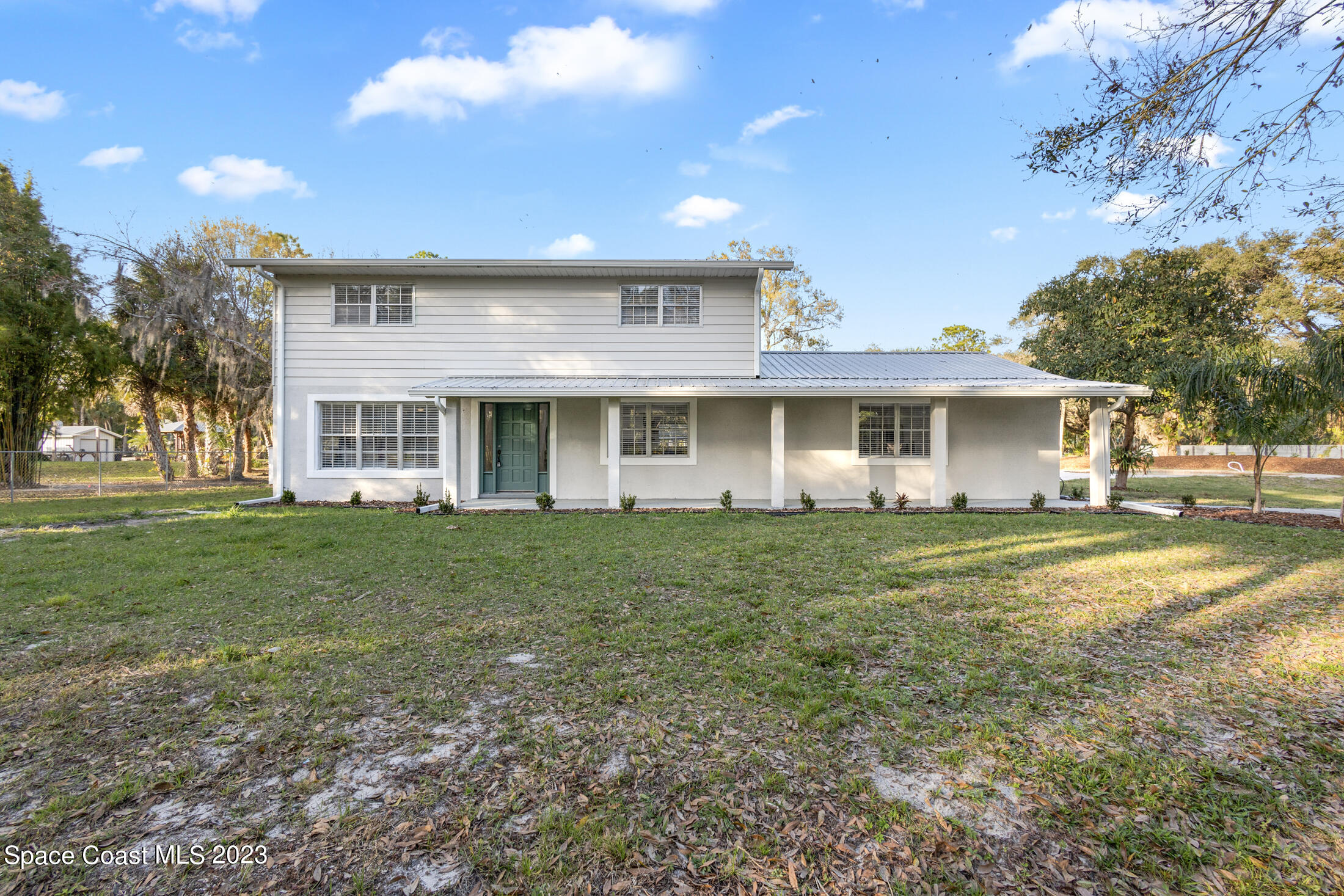 2300 Cox Road Cocoa, FL 32926 - Photo 2 of 41 a view of a house with a backyard