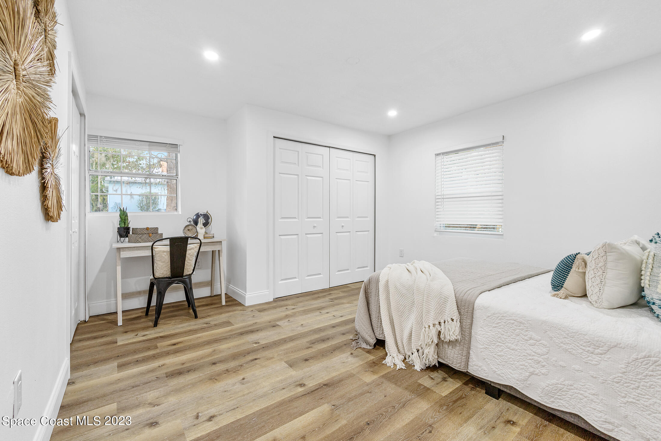 2300 Cox Road Cocoa, FL 32926 - Photo 29 of 41 a bedroom with a bed and a chair