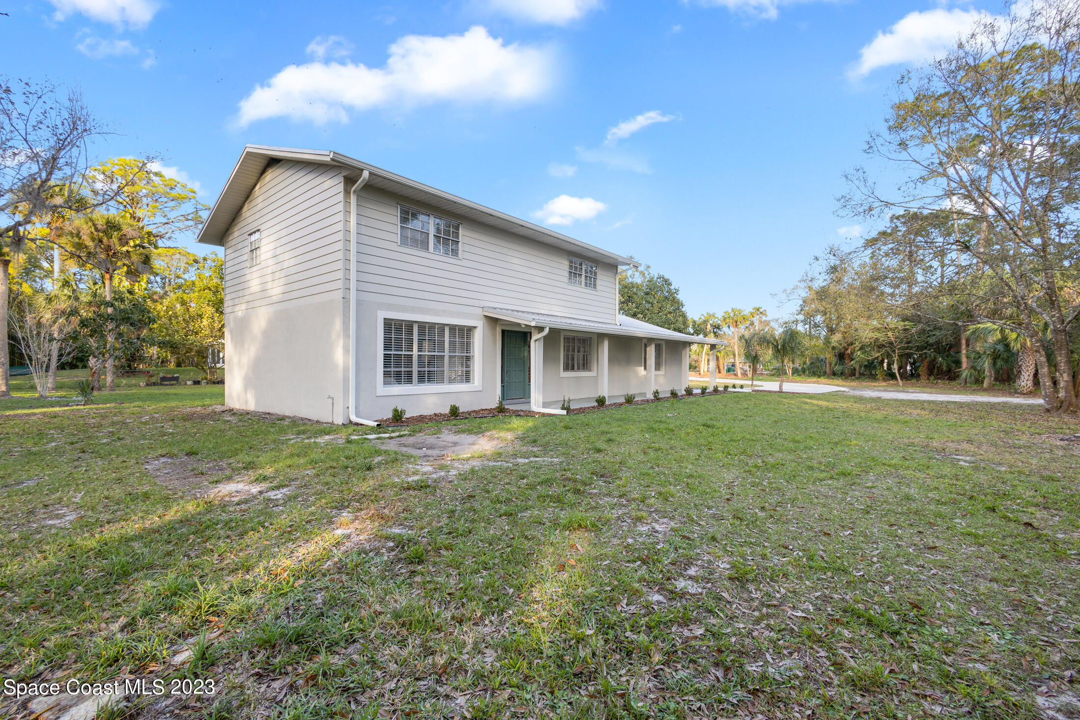 2300 Cox Road Cocoa, FL 32926 - Photo 32 of 41 a view of a house with yard and tree s