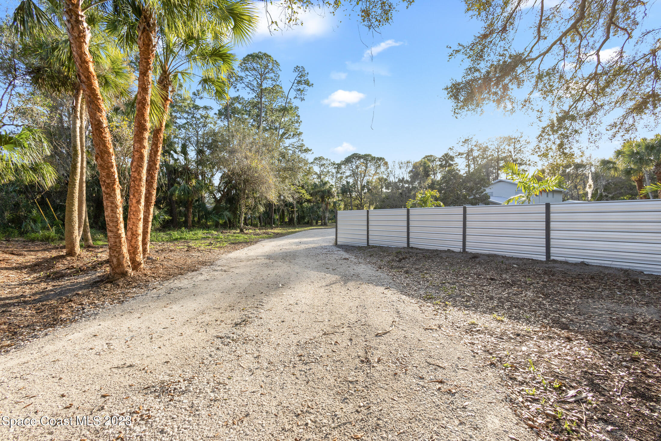 2300 Cox Road Cocoa, FL 32926 - Photo 34 of 41 a view of a yard with wooden fence