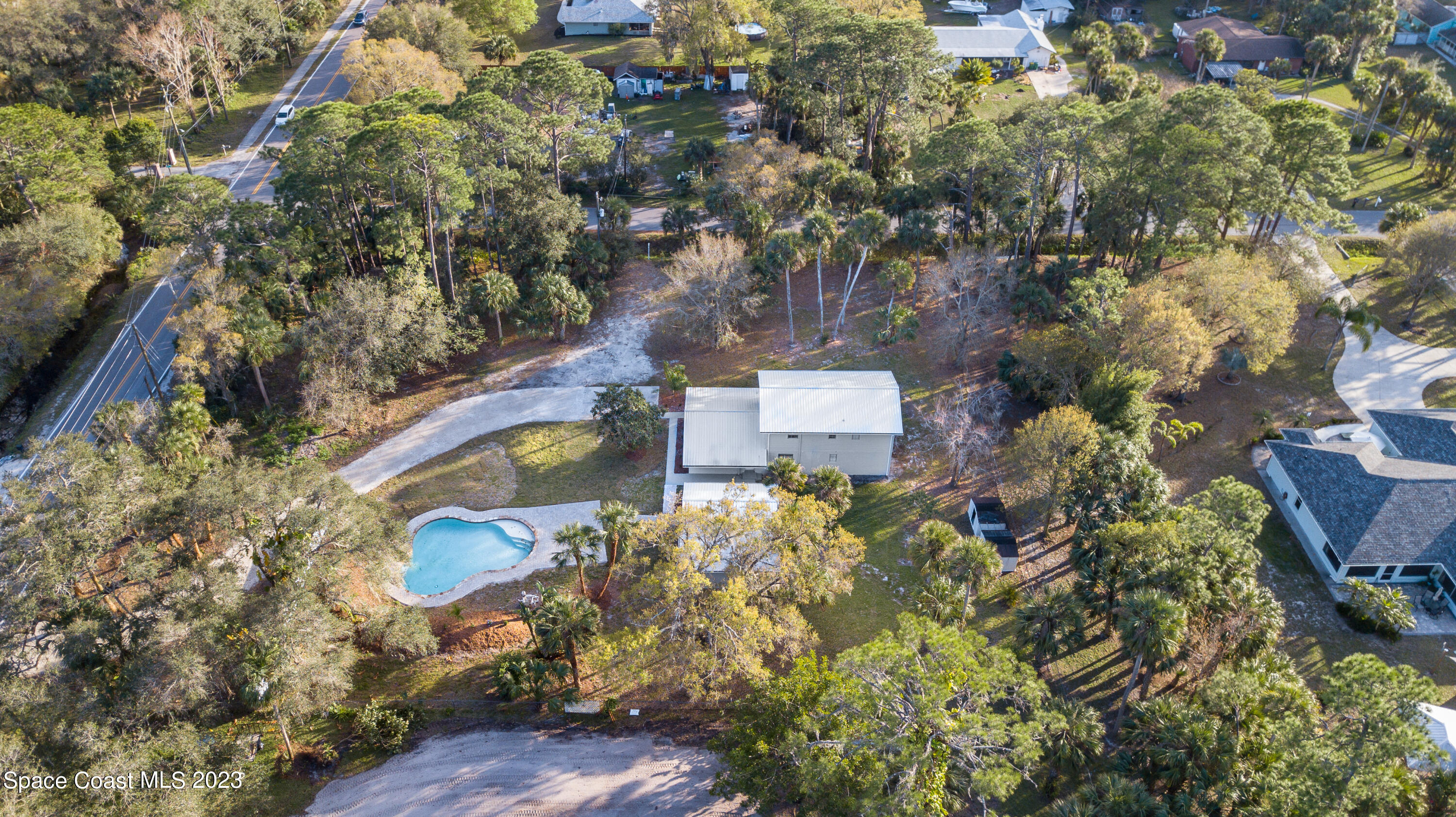 2300 Cox Road Cocoa, FL 32926 - Photo 36 of 41 an aerial view of house with yard swimming pool and outdoor seating