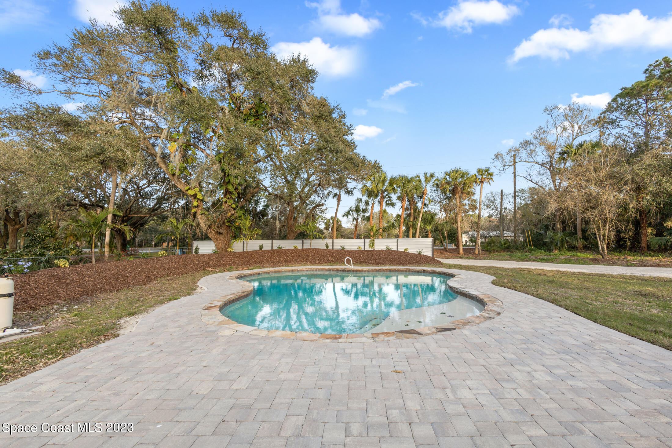 2300 Cox Road Cocoa, FL 32926 - Photo 4 of 41 a view of backyard with swimming pool and outdoor space