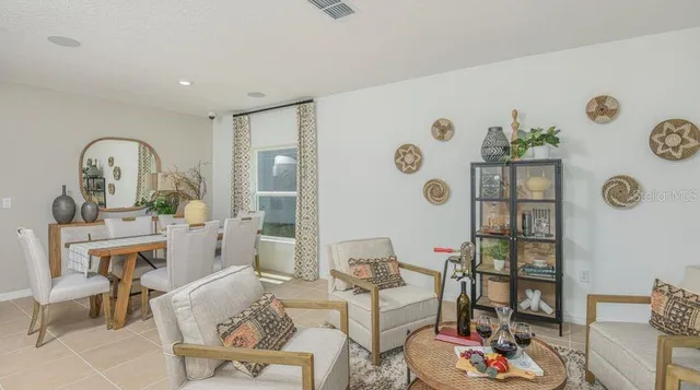a bedroom with a bed and a flat tv screen on the wall