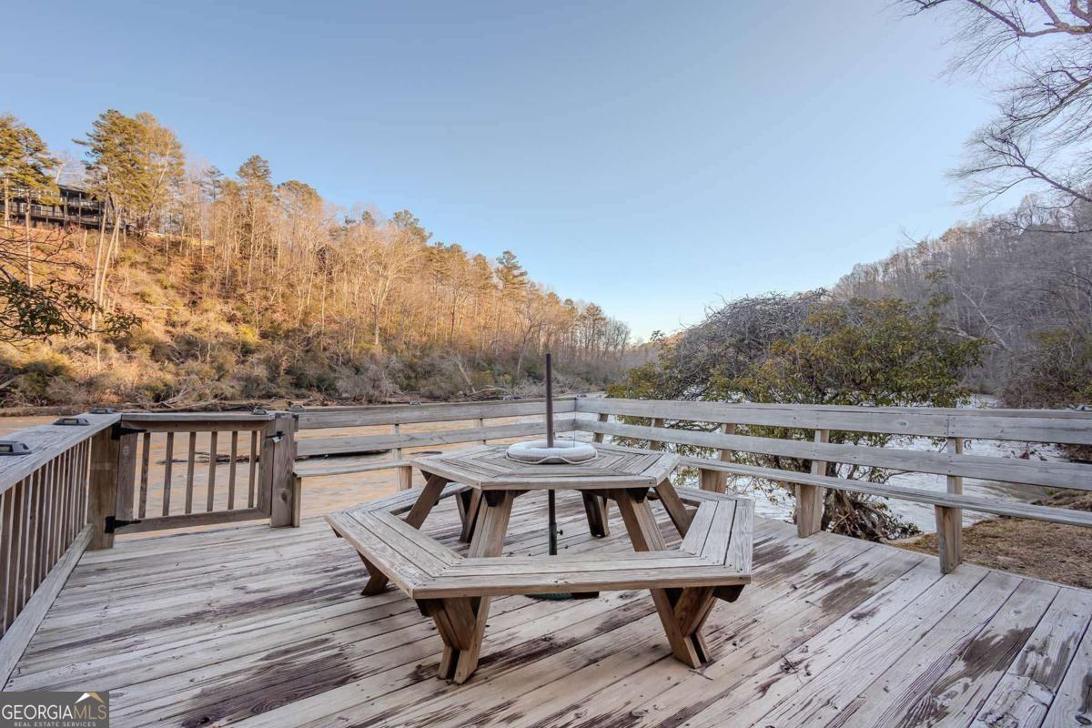 53 Addle Trail, Unit 2382 Ellijay, GA 30540 - Photo 11 of 42 a view of a balcony with furniture and wooden floor