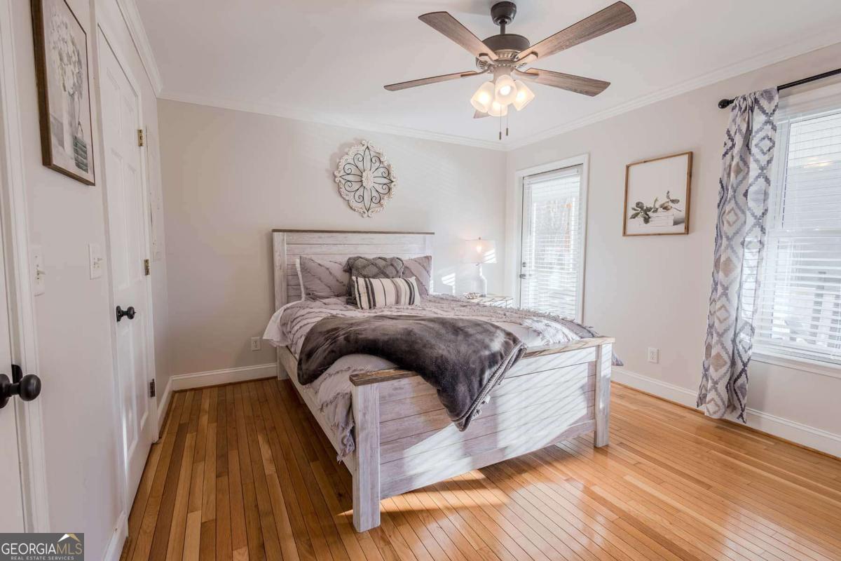 53 Addle Trail, Unit 2382 Ellijay, GA 30540 - Photo 19 of 42 a bedroom with a bed and a ceiling fan