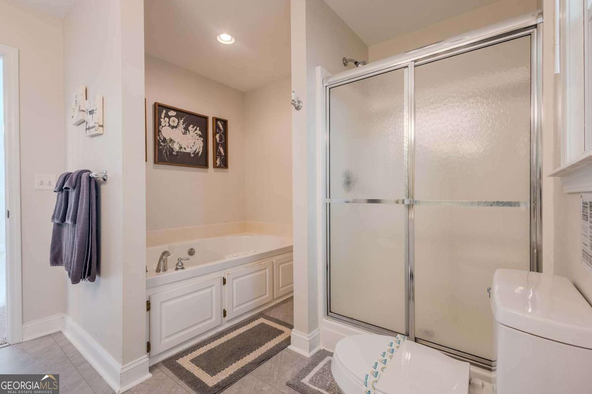 53 Addle Trail, Unit 2382 Ellijay, GA 30540 - Photo 34 of 42 a bathroom with a shower and a tub