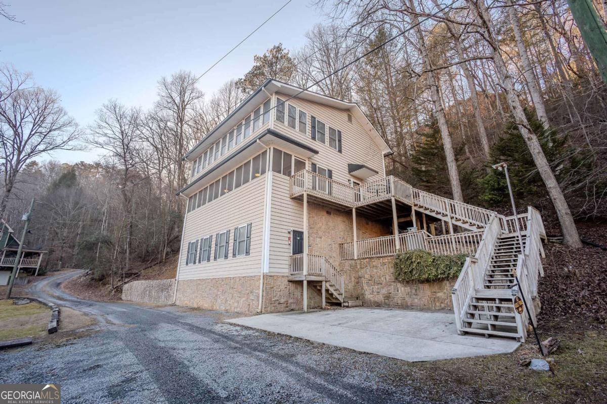 53 Addle Trail, Unit 2382 Ellijay, GA 30540 - Photo 4 of 42 a view of a house with a yard