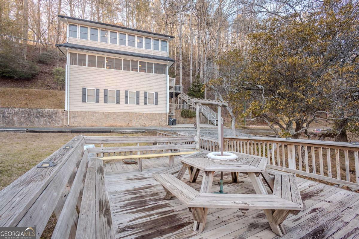 53 Addle Trail, Unit 2382 Ellijay, GA 30540 - Photo 10 of 42 a view of balcony with wooden floor and outdoor seating
