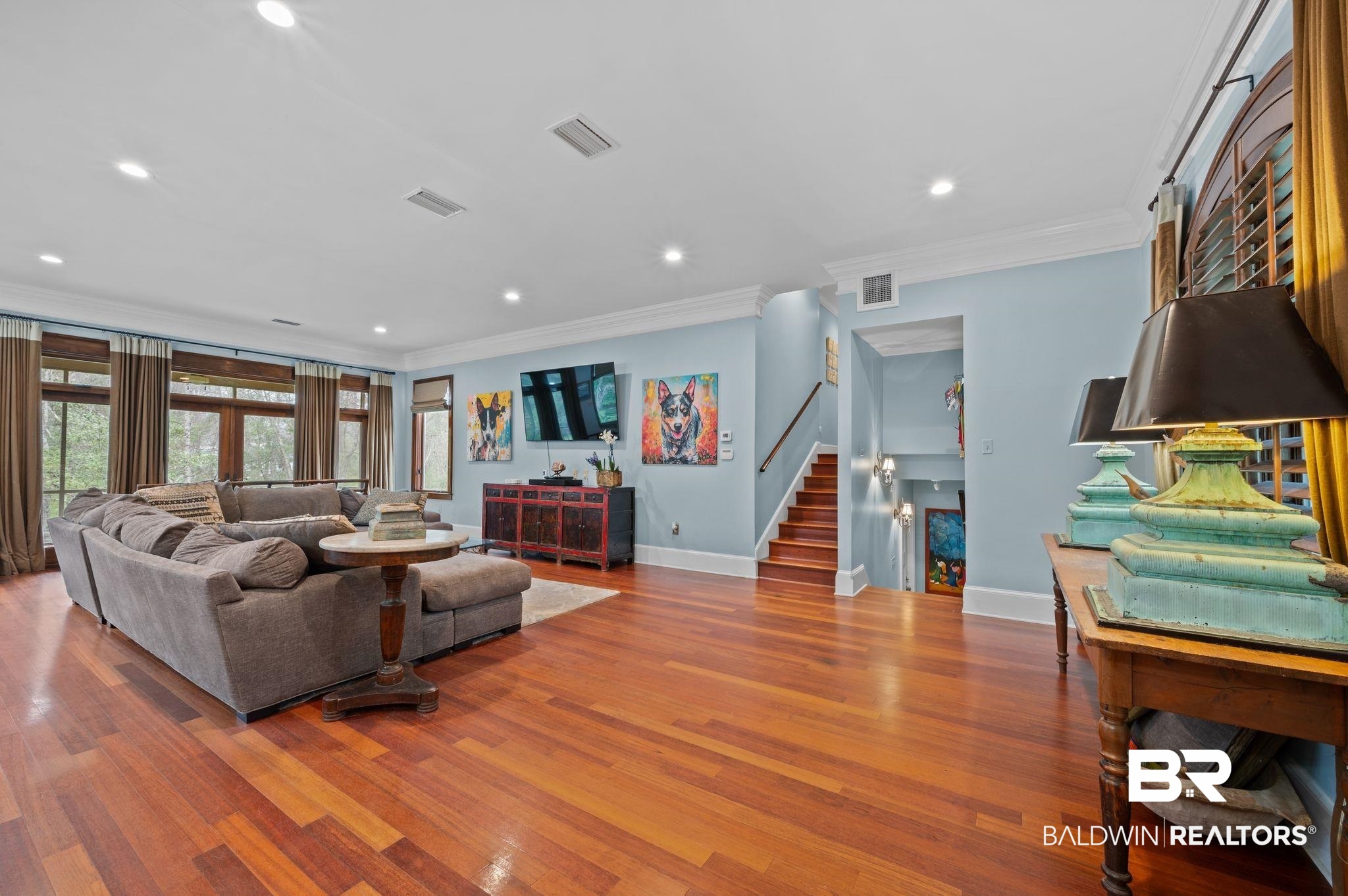 7850 Yorkhaven Road Mobile, AL 36695 - Photo 10 of 57 Living area with visible vents, wood finished floors, and stairs