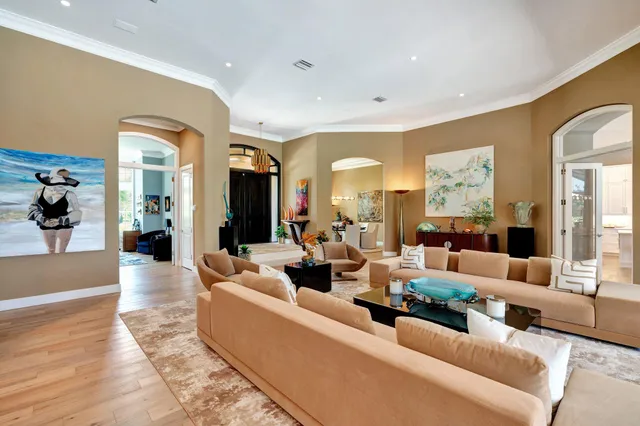 a view of a patio with a table chairs and a small yard