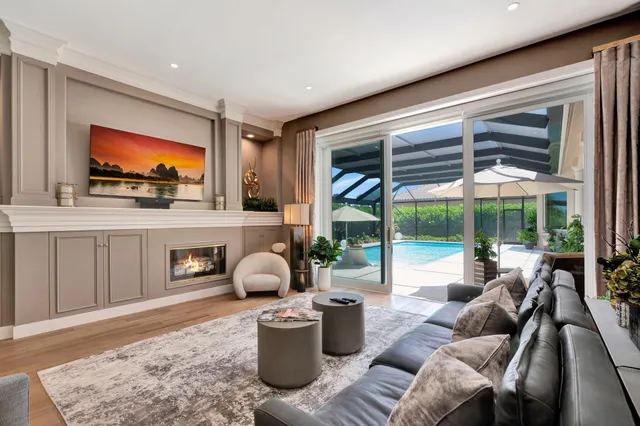 a bathroom with a potted plant and a bathtub