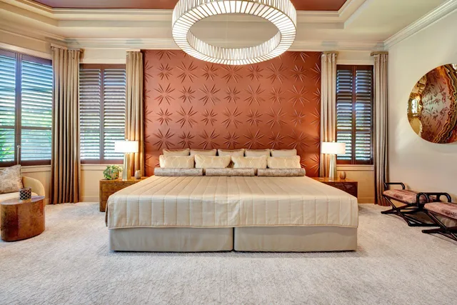 a front view of a house with a yard and potted plants