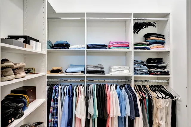 an aerial view of a house with garden space and street view