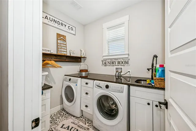 a utility room with dryer and washer