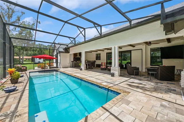 a view of a backyard with a patio and a patio