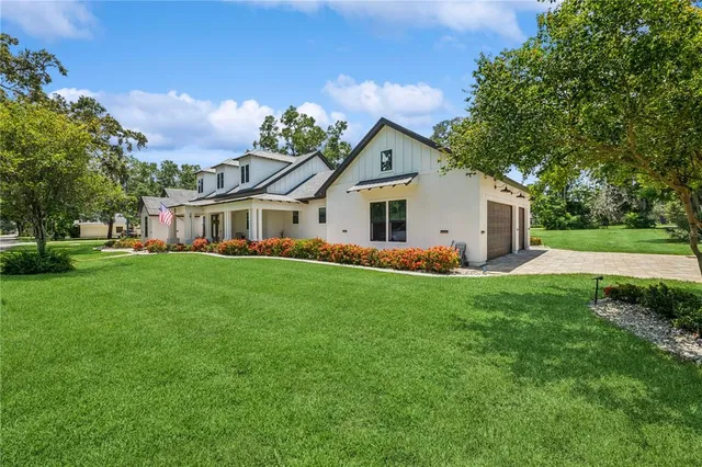 a front view of house with yard and green space